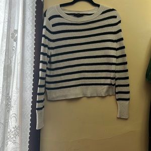 I am selling a white and black striped sweater.
